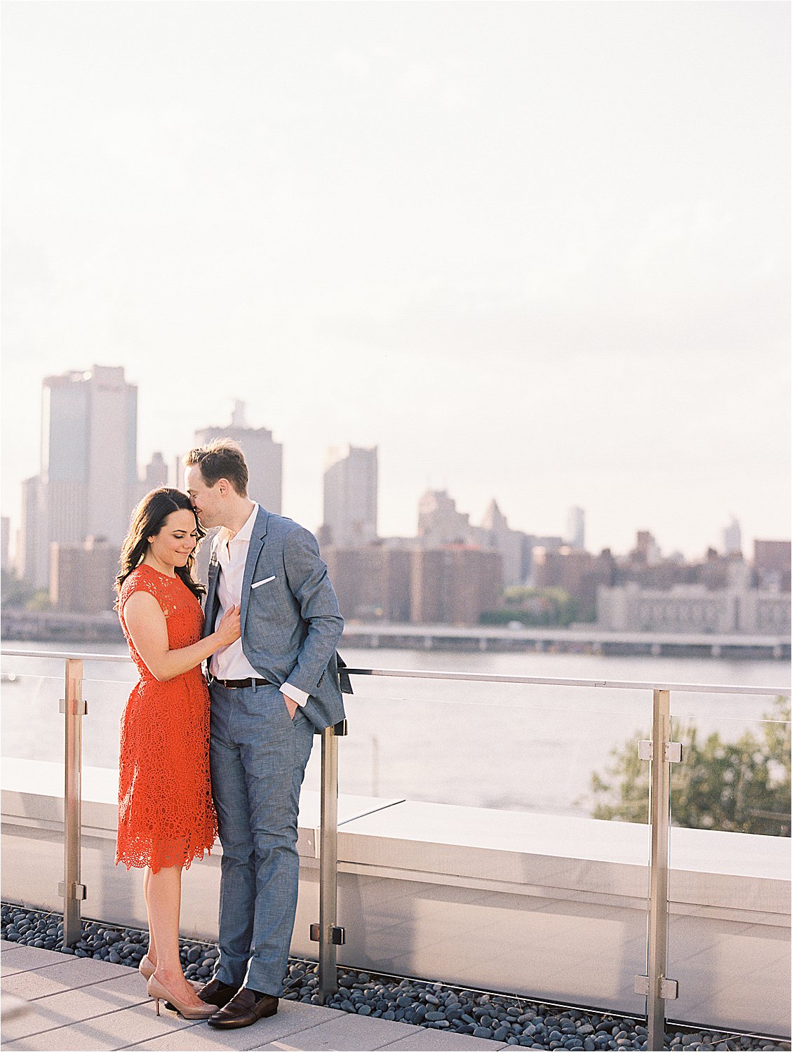 Planning Your Engagement Session with Florida and DC Film Wedding and Engagement Photographer, Renee Hollingshead. Pick a meaningful location, like the rooftop of your building. DUMBO Brooklyn New York Engagement