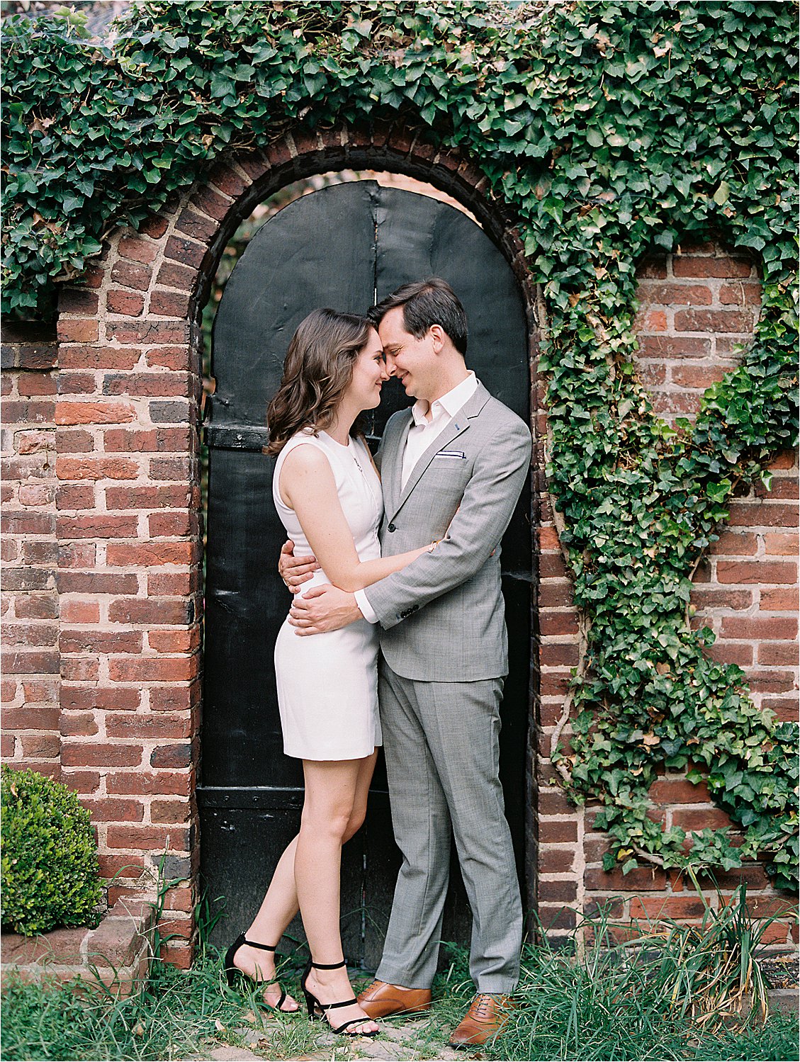 Classic Virginia Engagement Session against ivy-filled brick wall with Alexandria Film Wedding Photographer, Renee Hollingshead