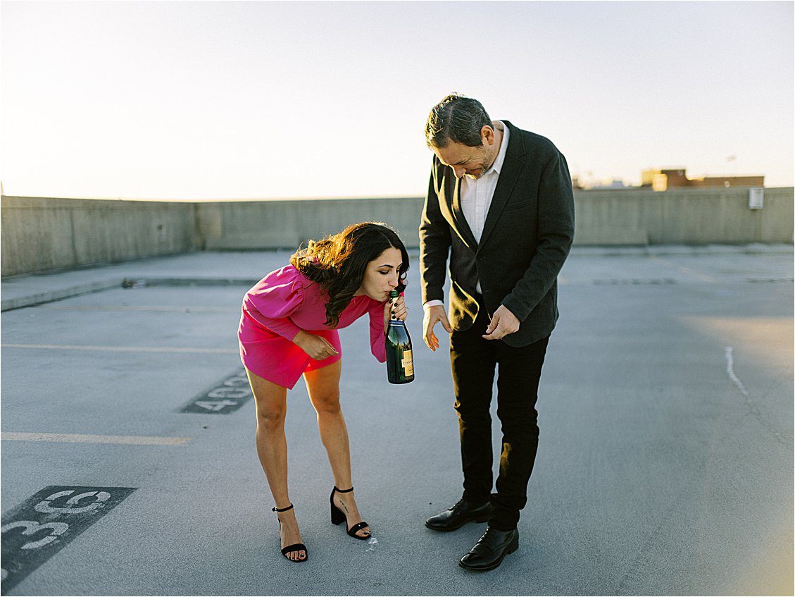 Champagne Toast at Winter DC Rooftop Engagement Session at Union Station With DC Wedding Photographer, Renee Hollingshead