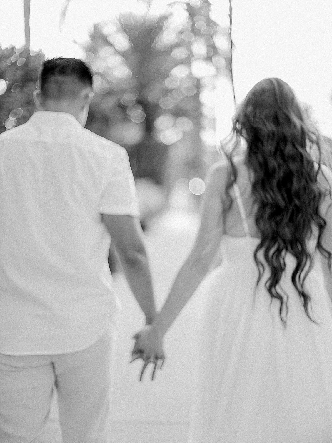 Black and White blurred engagement session with film wedding photographer, Renee Hollingshead