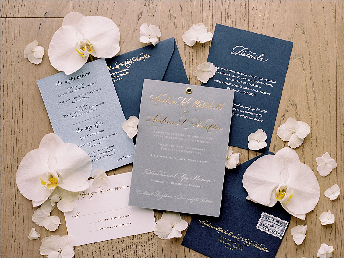 Shades of blue invitation on handmade paper with modern gold embossed calligraphy and orchids by Laura Hooper Design House