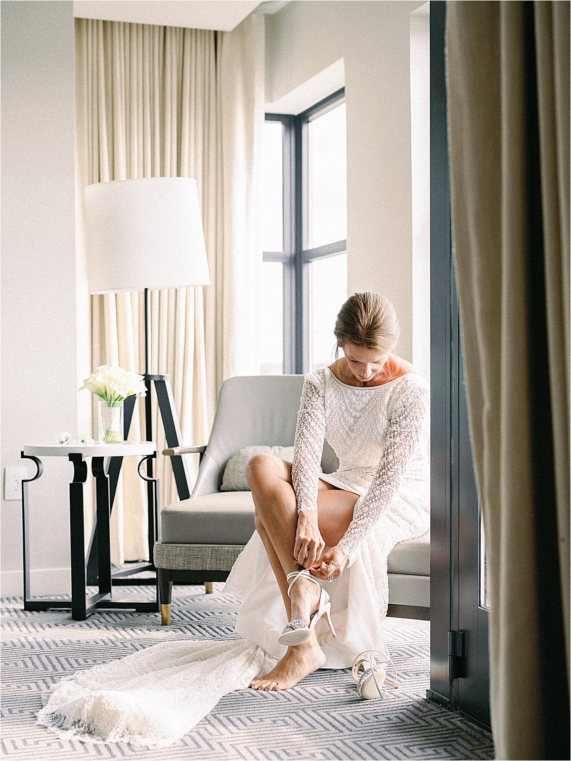 Bride gets dressed at Intercontinental Wharf DC at Summer Rooftop Wedding