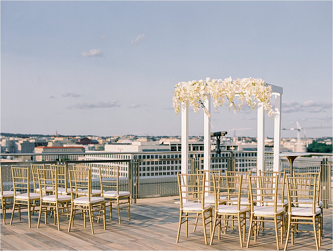 Orchid Filled Chuppah at Luxury Rooftop Spy Museum Wedding as seen in Washingtonian Weddings with Renee Hollingshead and A Griffin Events