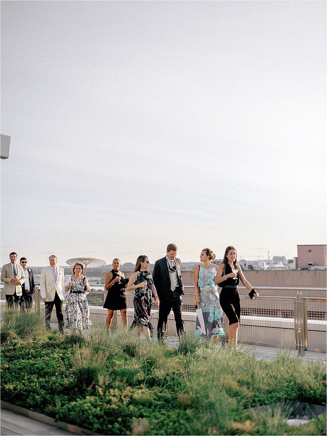 Guests walk to ceremony for DC Rooftop Wedding as seen in Washingtonian Weddings with Renee Hollingshead and A Griffin Events