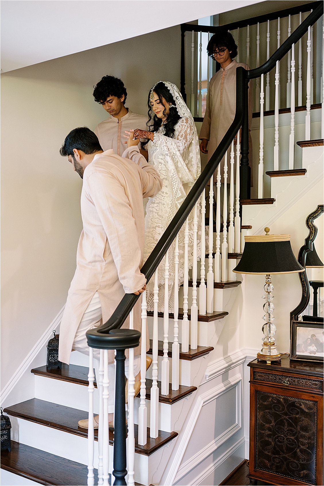 Bride walks down the stairs at her Nikkah ceremony at home
