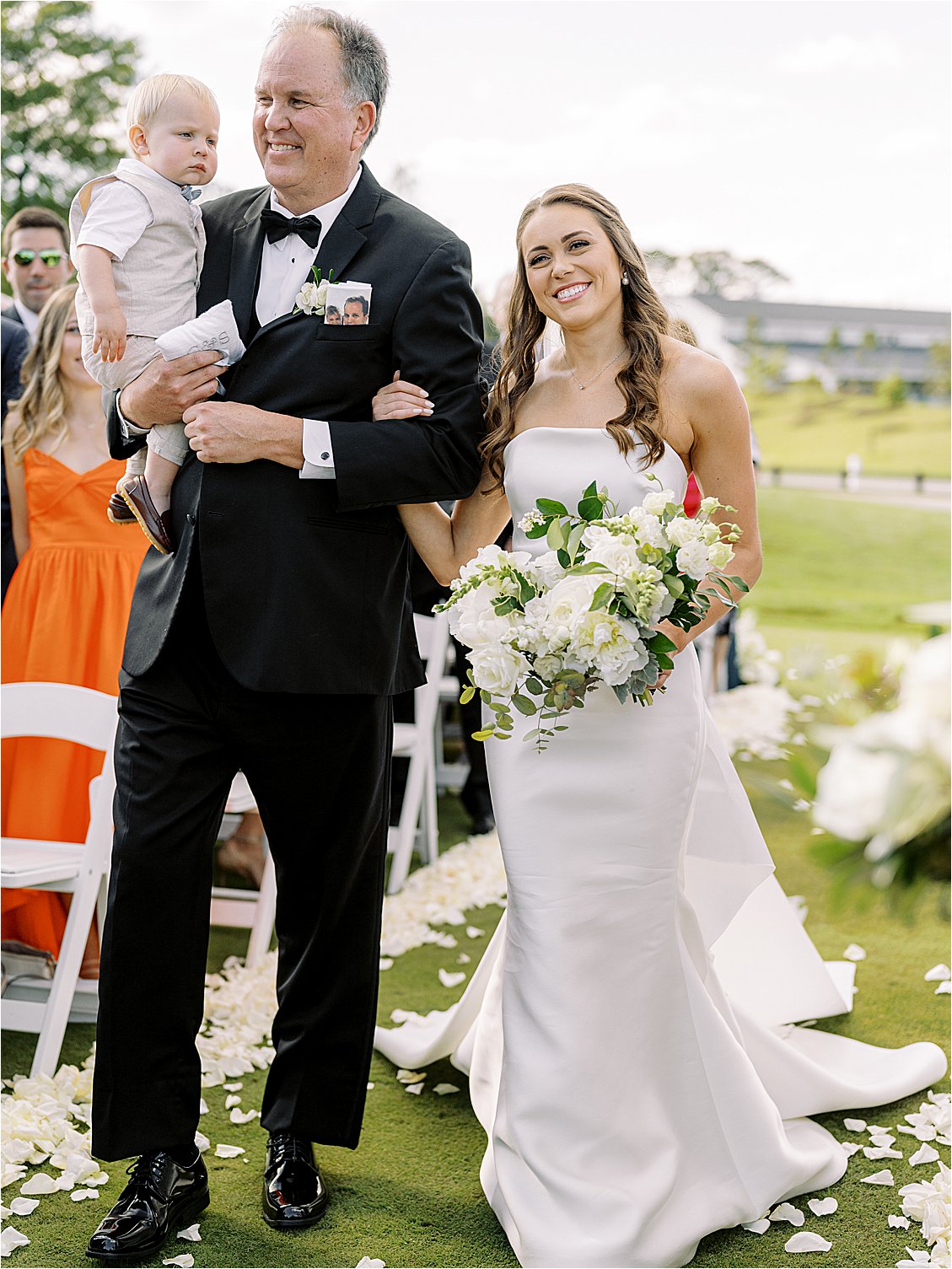 Bride walks down the aisle with Father of the Bride at outdoor ceremony in Delaware
