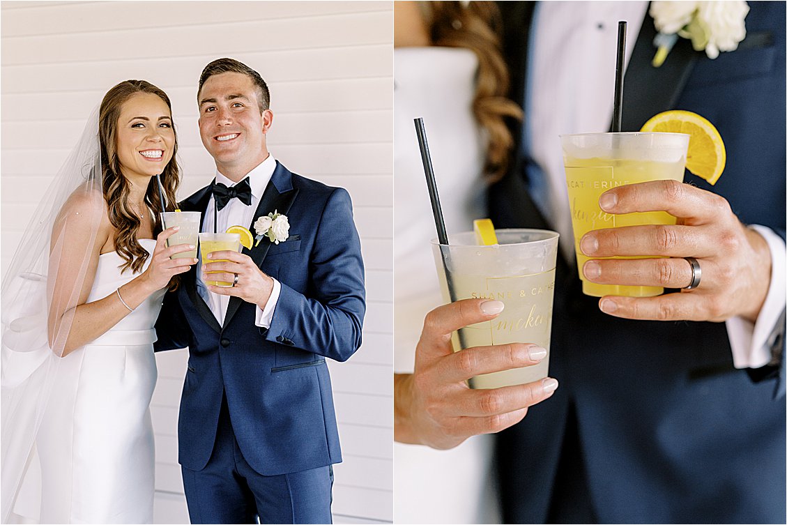 Bride and groom holding signature orange crush wedding drinks at Delaware wedding