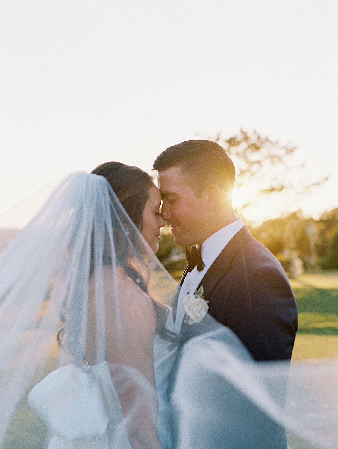 Bride and Groom during sunset portraits at Fenwick Island, Delaware Wedding with Destination Wedding Photographer, Renee Hollingshead