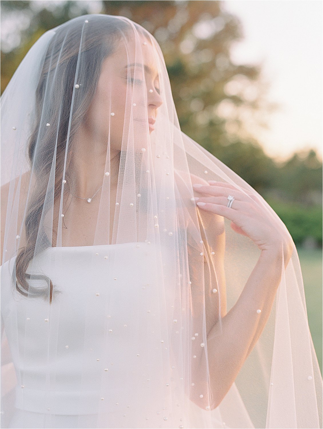 Bride in pearl veil at Golden Hour Portraits at Fenwick Island, Delaware Wedding with Destination Wedding Photographer, Renee Hollingshead