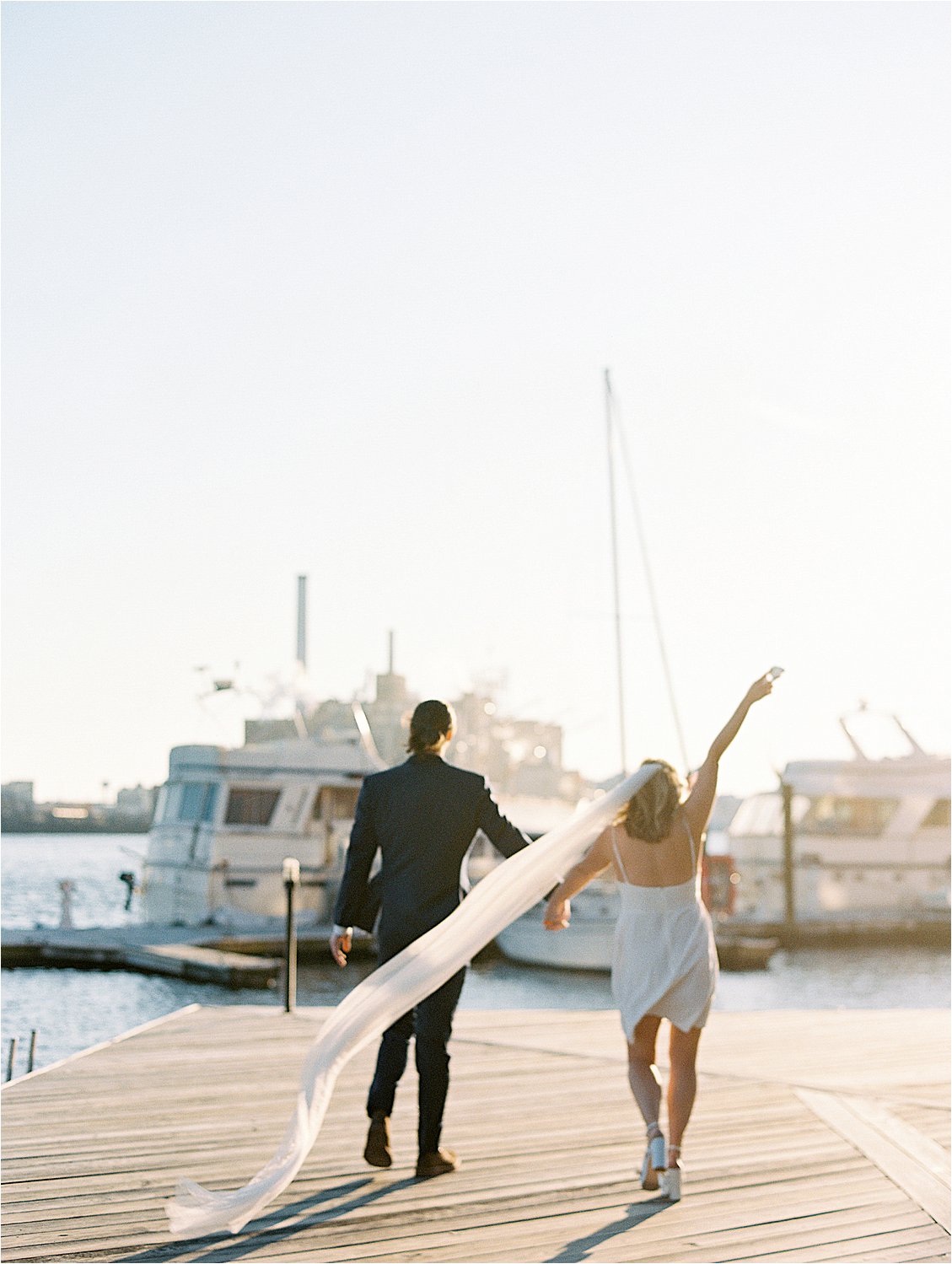 Fun Fells Point Engagement session in formalwear with film wedding photographer Renee Hollingshead and Pop the Cork Designs