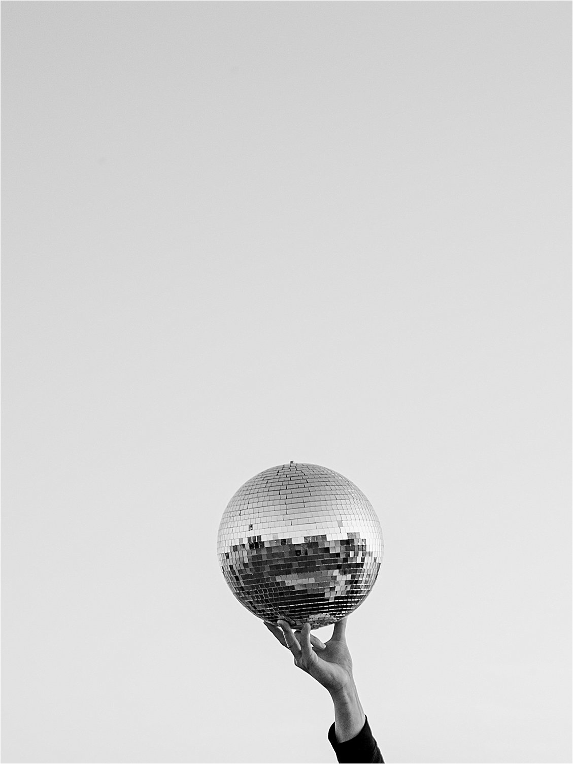 Disco ball in the city with destination wedding photographer Renee Hollingshead
