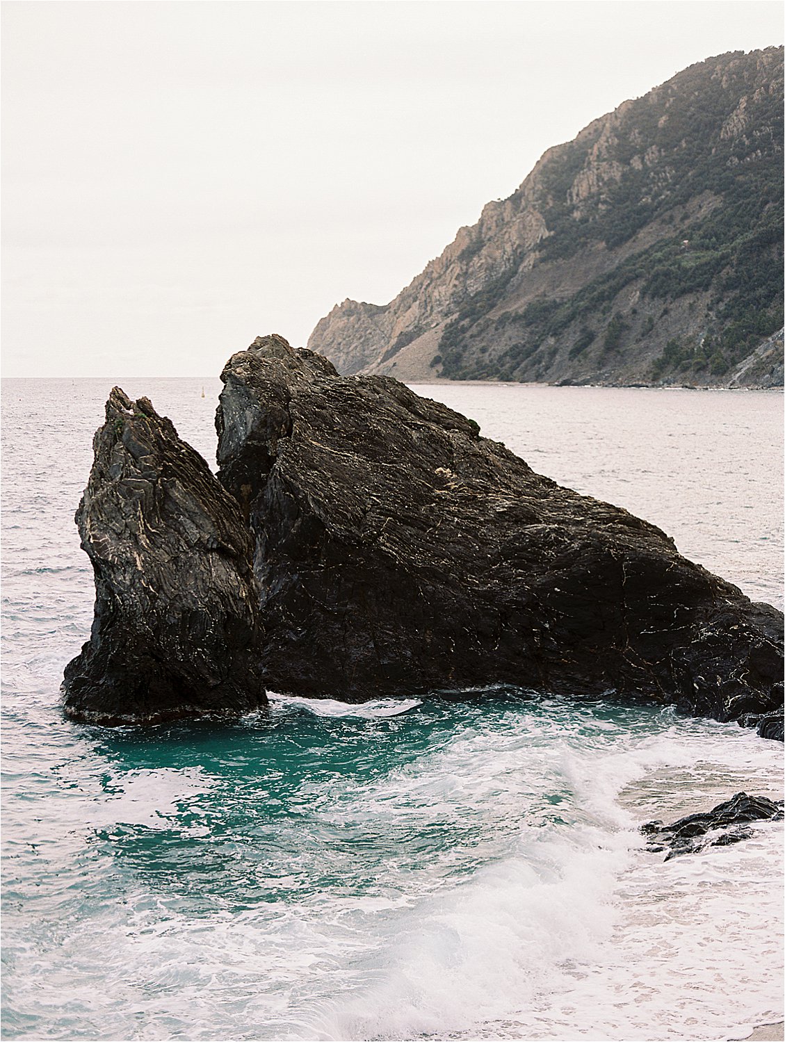 Waterfront in Monterosso al Mare, Cinque Terre, Italy on film with destination wedding film photographer Renee Hollingshead