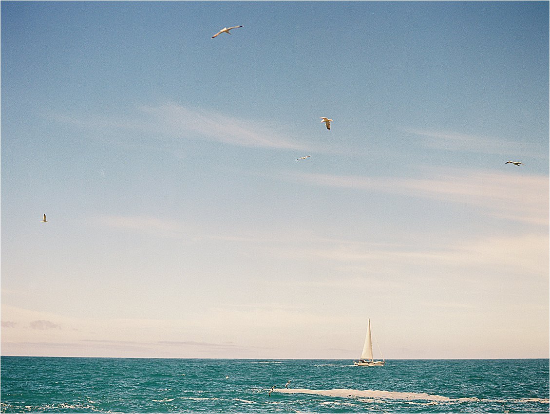 Sailboats in Cinque Terre, Italy on film with destination wedding film photographer Renee Hollingshead