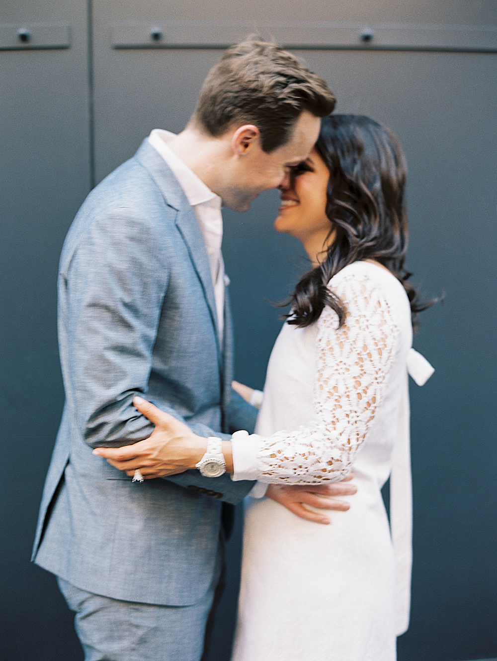 Couple embracing during Summer Brooklyn engagement session with New York + Destination film wedding photographer Renee Hollingshead