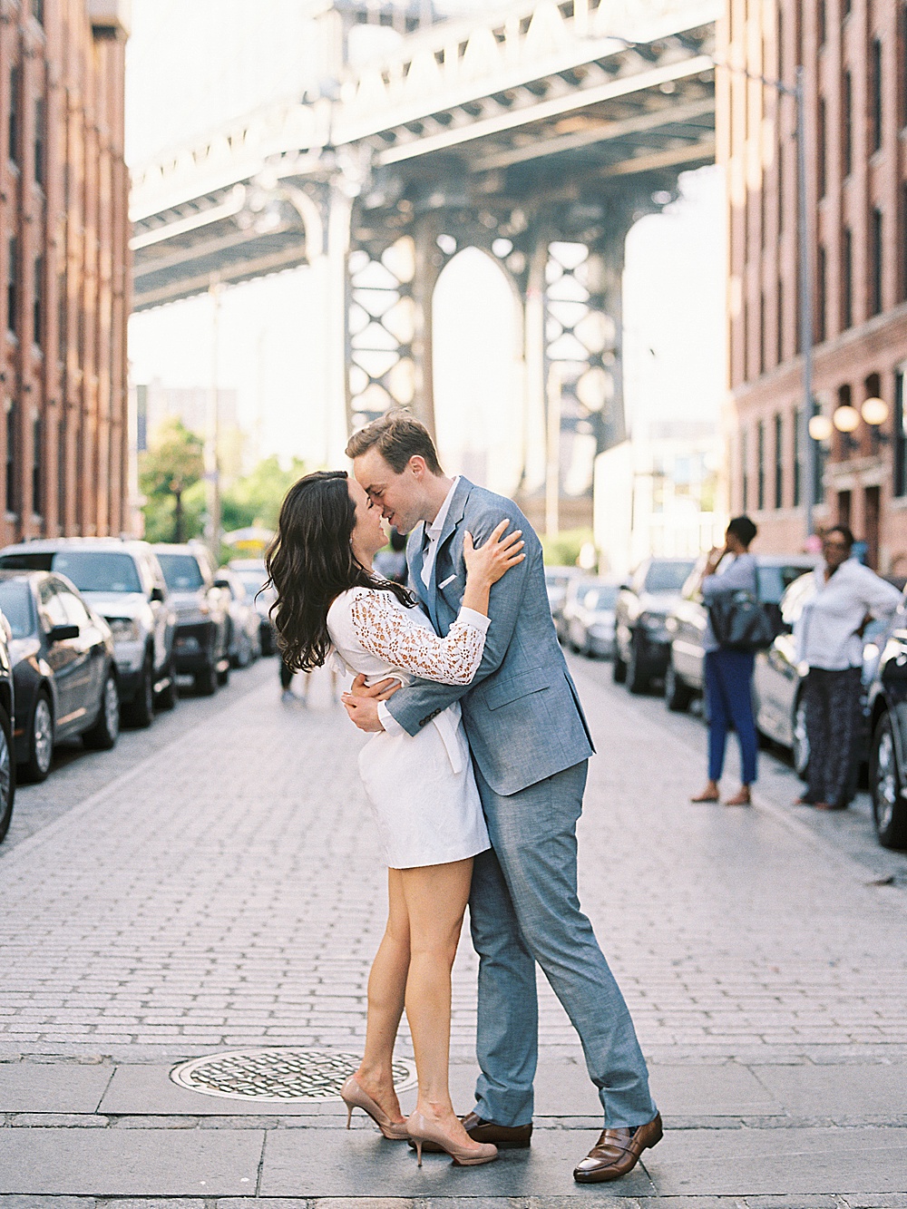 Couple kissing on Iconic Washington Street in Dumbo Brooklyn