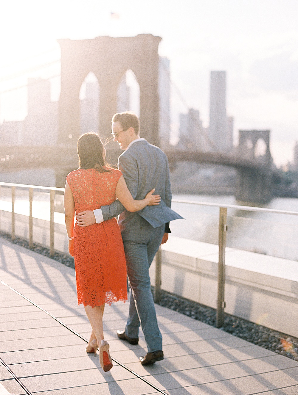 Couple strolling rooftop of Brooklyn Summer engagement session on film with Renee Hollingshead