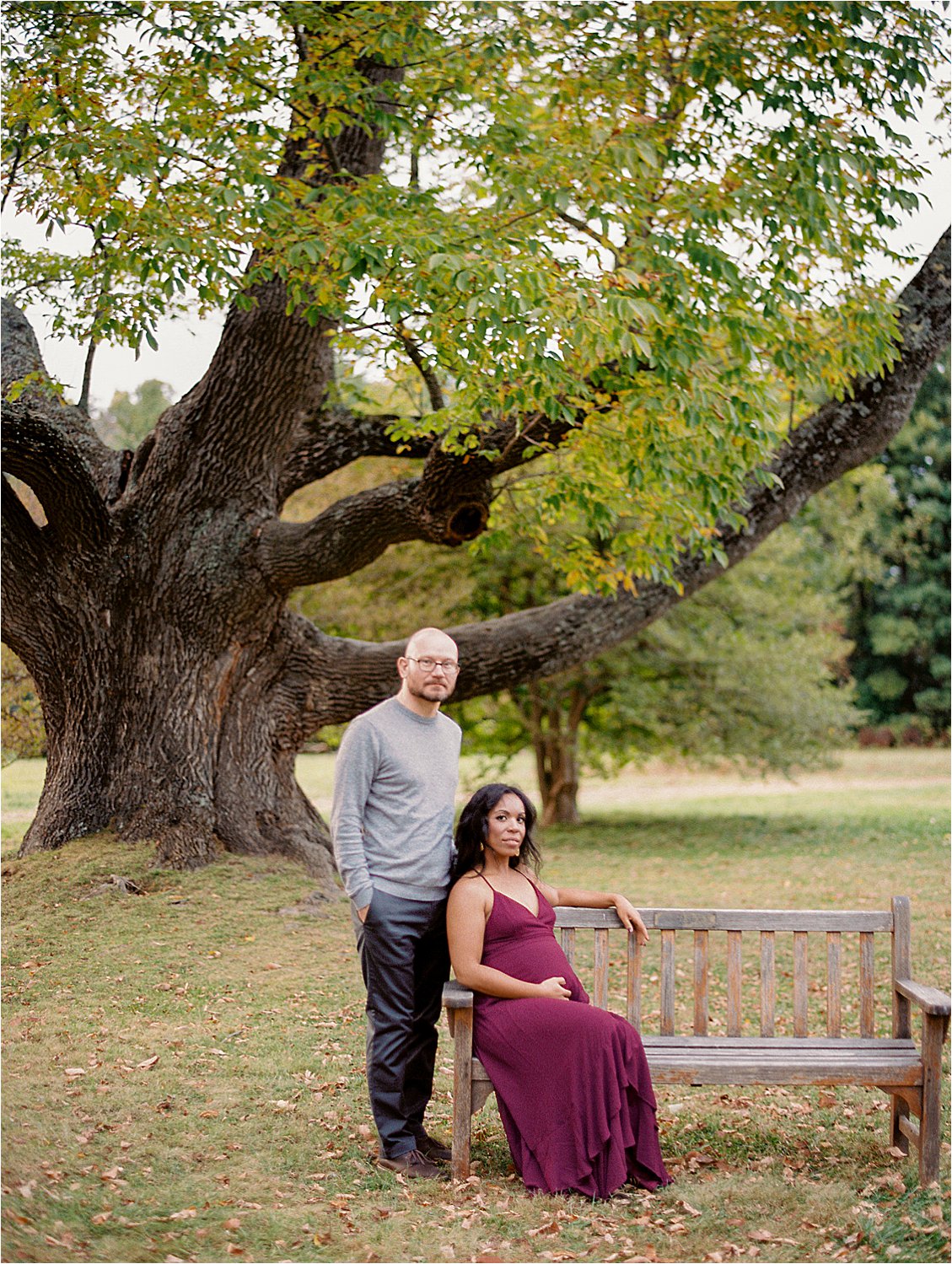 Parents to be at fall outdoor Maternity session at Stevens-Coolidge House with destination film photographer Renee Hollingshead