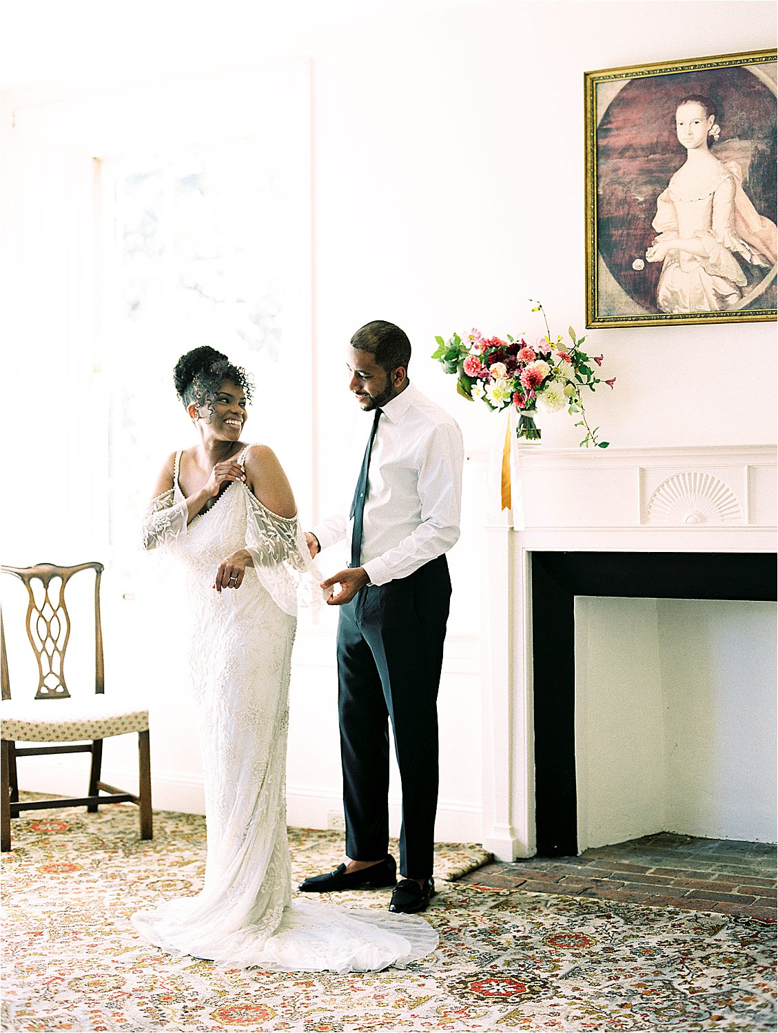 Bride and Groom get dressed together on wedding day photographed by DC Film Wedding Photographer, Renee Hollingshead