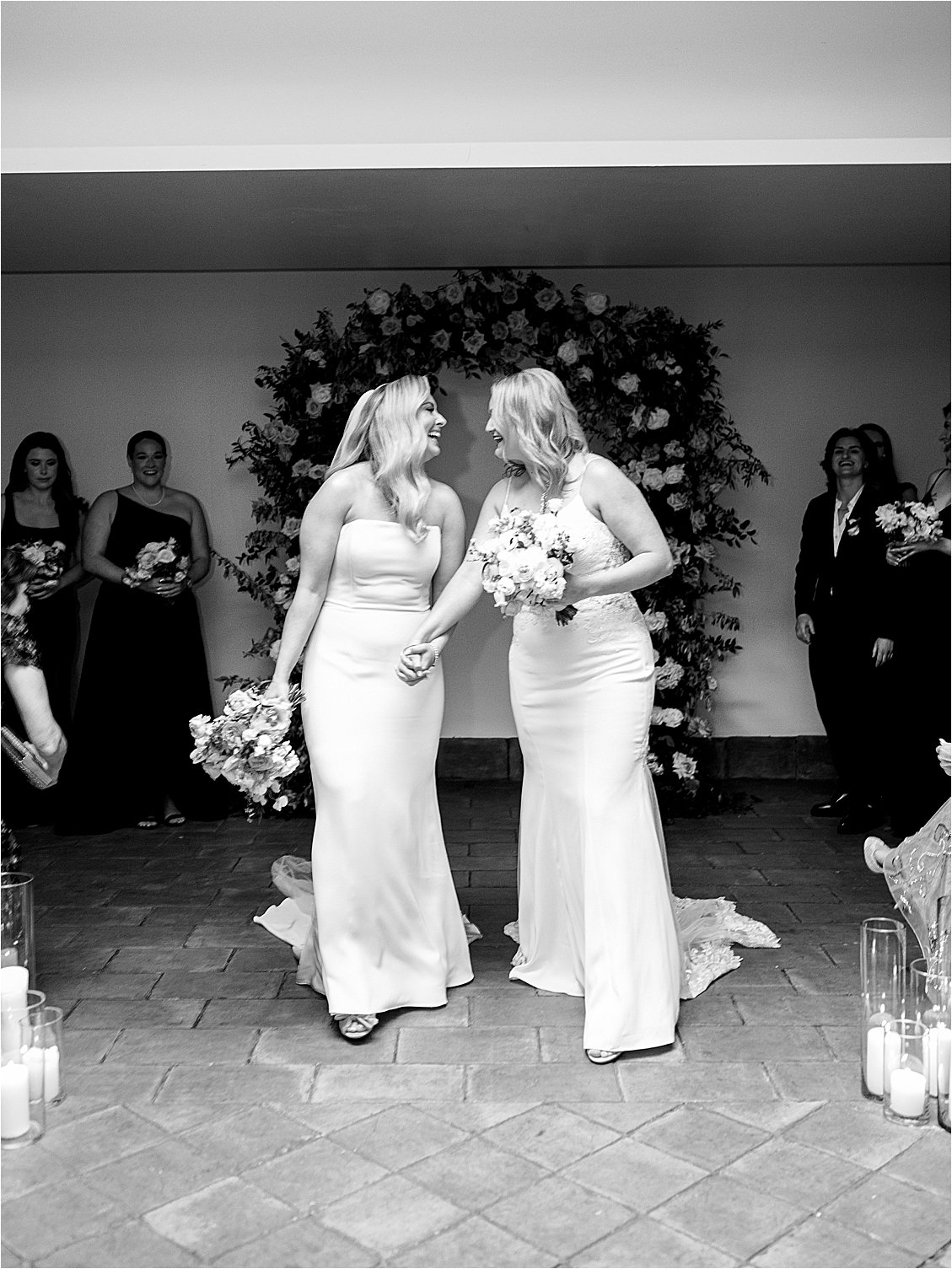 Black and white image of brides after officially tying the know