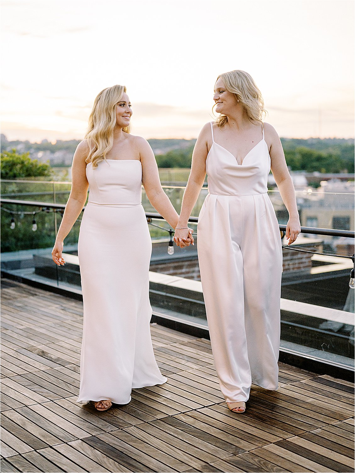 Brides on the rooftop during golden hour at The Line Hotel in Washington DC with film wedding photographer Renee Hollingshead