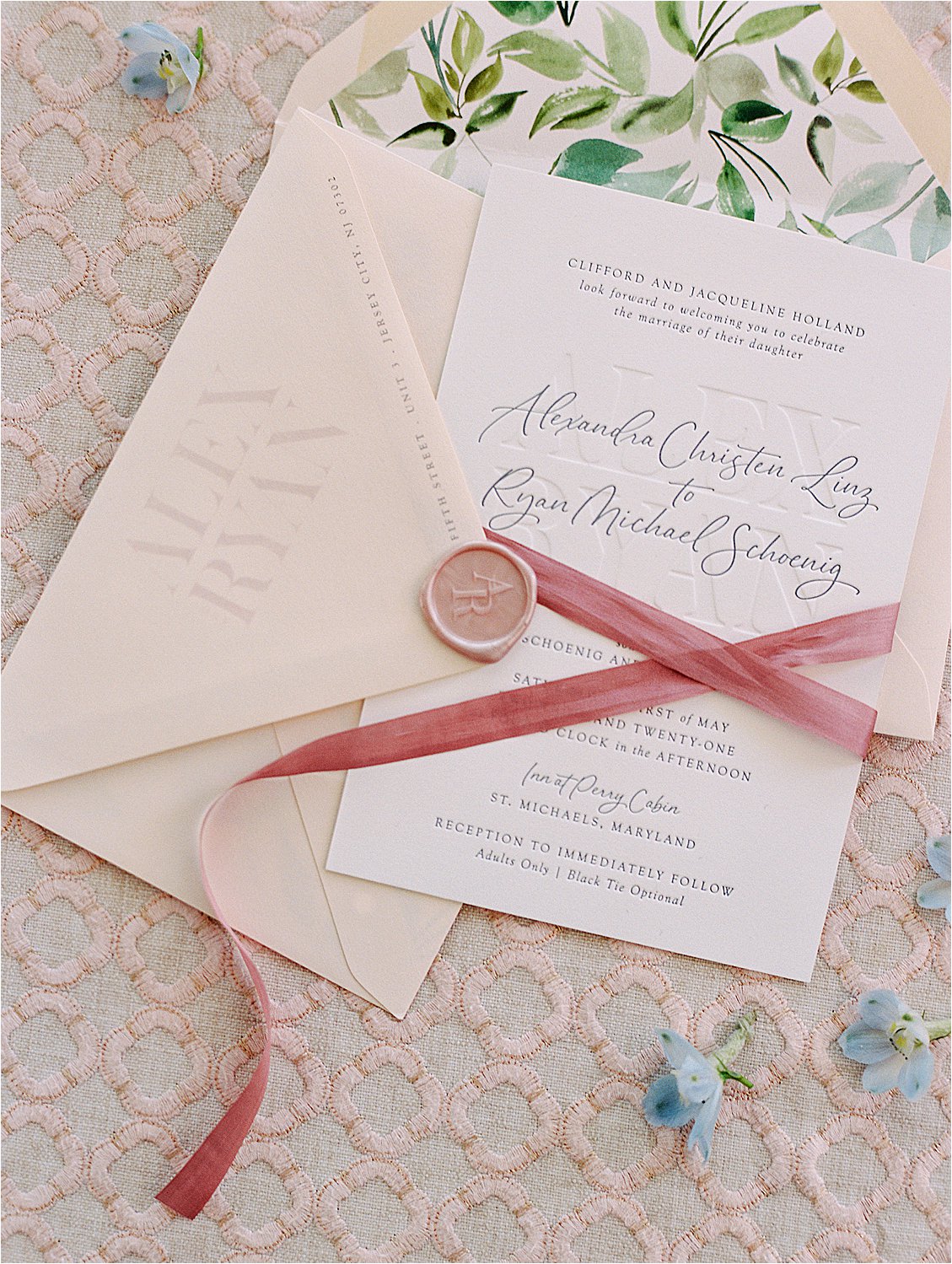 Romantic and modern debossed wedding invitation with blush envelope and rose colored silk ribbon by film destination wedding photographer, Renee Hollingshead with Kari Rider Events at Inn at Perry Cabin in St. Michaels, Maryland.