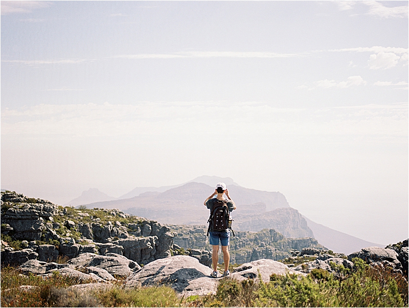 Tourist on top of Table Mountain in Cape Town, South Africa with film destination wedding and travel photographer, Renee Hollingshead