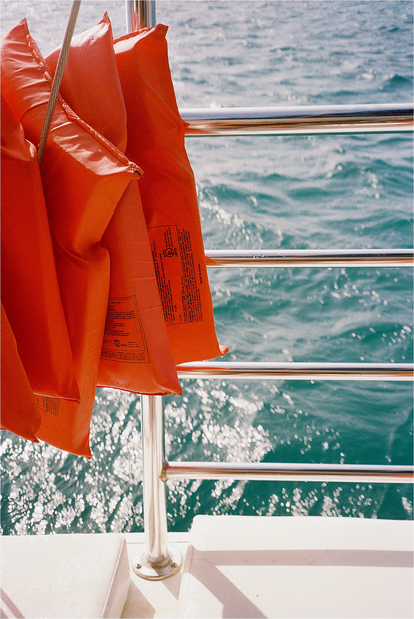 Bright orange life vests aboard the Chukka Adventures catamarans is a must in this Jamaica Travel Guide