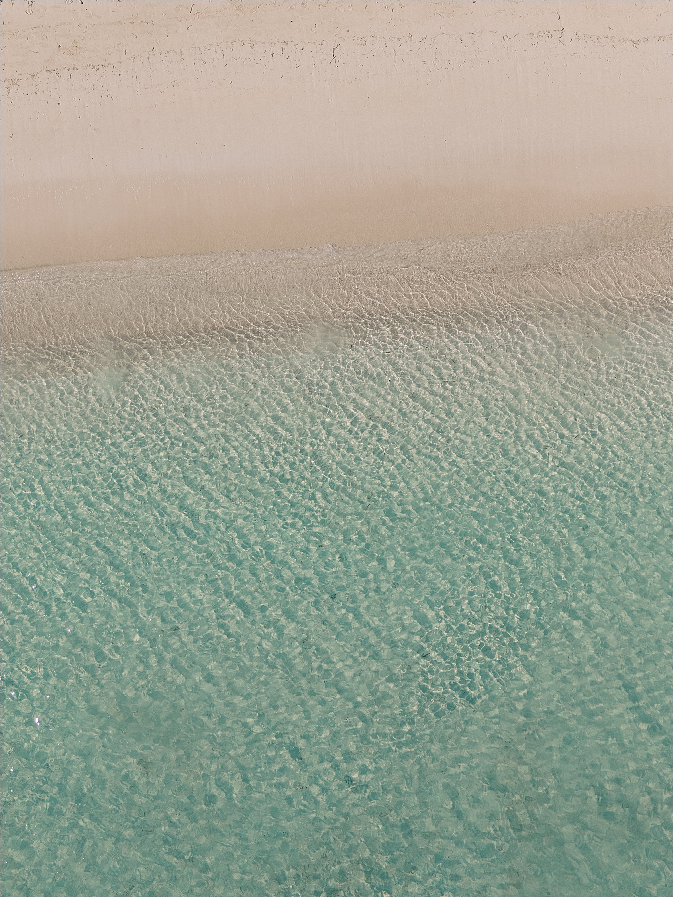 Aerial view of the calm Jamaica ocean waters by destination wedding photographer Renee Hollingshead