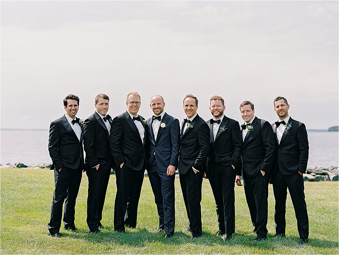 Groom and groomsmen portrait overlooking the Chesapeake Bay at Oxford Maryland waterfront wedding