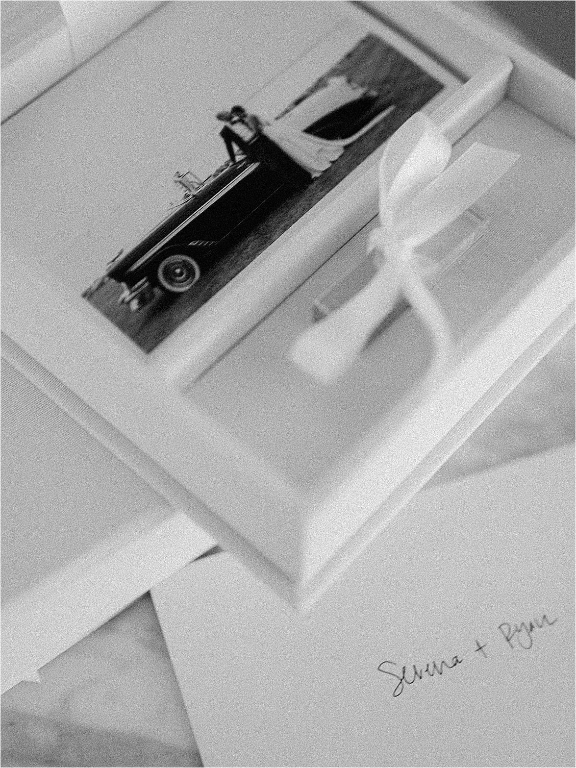 Framed black and white film wedding print tied with ribbon, handwritten names Selena and Ryan, Renee Hollingshead Photography