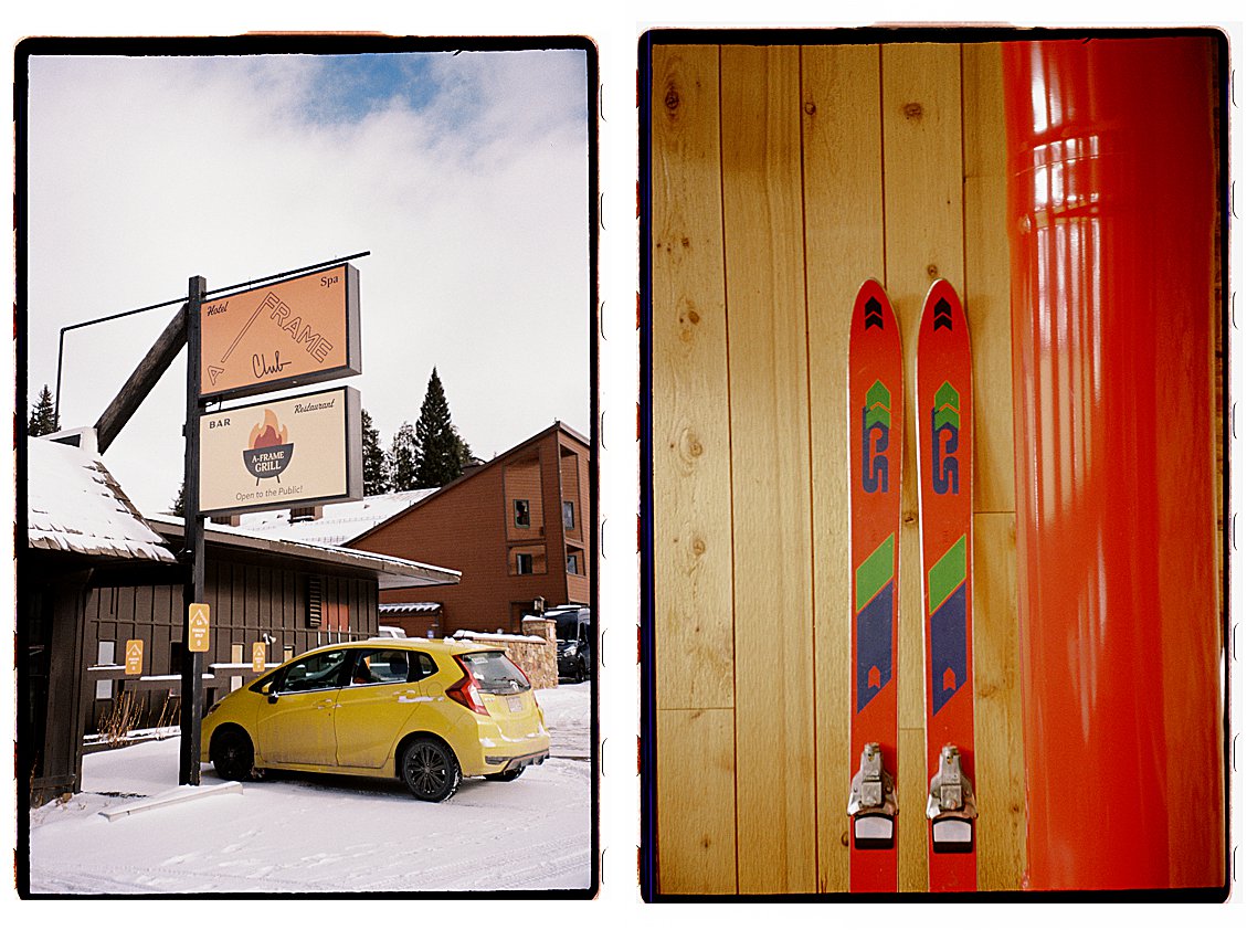A-Frame Club Hotel and Spa sign in Winter Park Colorado with a yellow car parked in the snow, alongside red skis leaning against warm pine wood paneling. Film photo by Renee Hollingshead on Kodak ColorPlus 200.