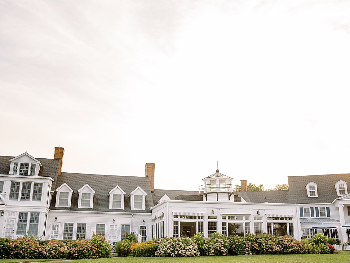 Inn at Perry Cabin wedding venue exterior with hydrangeas and lighthouse cupola at golden hour, St. Michaels Maryland, photographed by Renee Hollingshead Photography