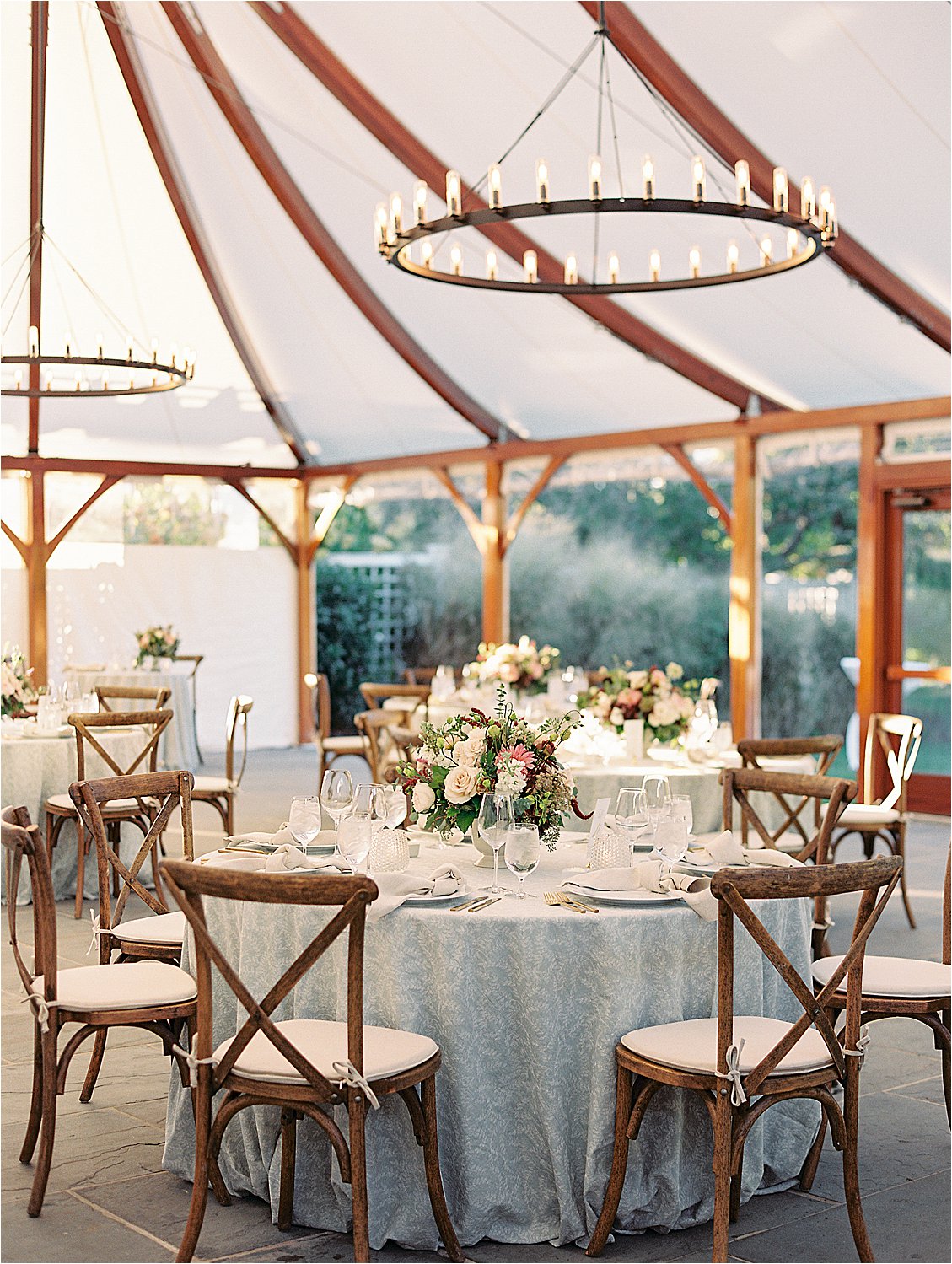 The Cove wedding reception at Inn at Perry Cabin with candlelit chandeliers and blush floral centerpieces, photographed by Renee Hollingshead Photography