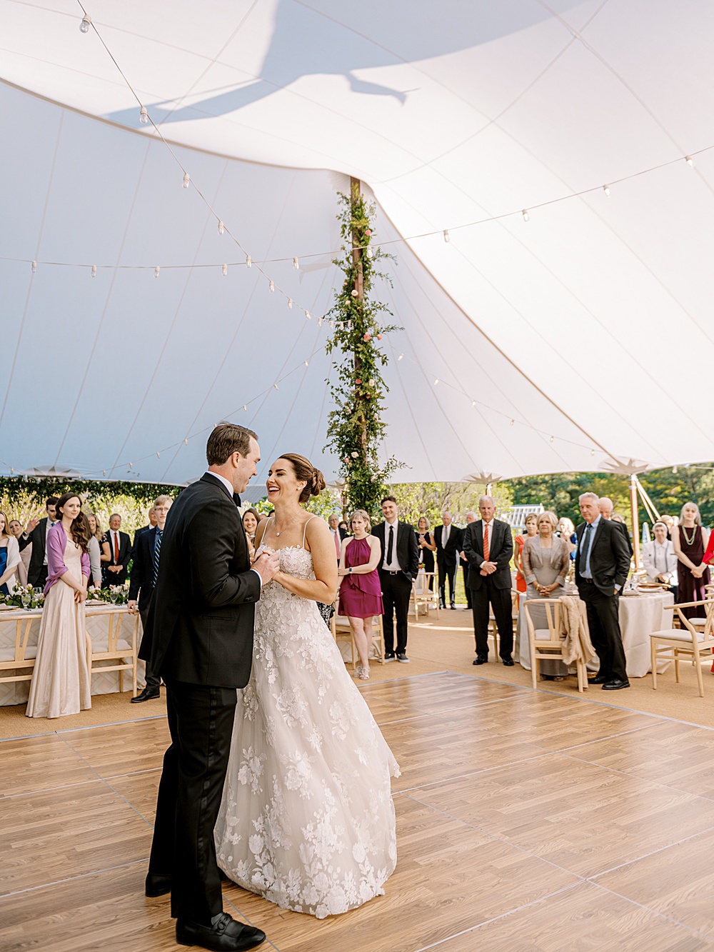 Bride and groom first dance under sailcloth tent at Inn at Perry Cabin waterfront wedding, photographed by Renee Hollingshead Photography